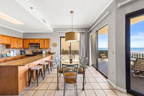 Enjoy meals in the kitchen with an oven and microwave, then dine at the adjacent glass-top table.