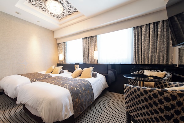 Deluxe Twin Room, Non Smoking | Down comforters, desk, blackout drapes, iron/ironing board