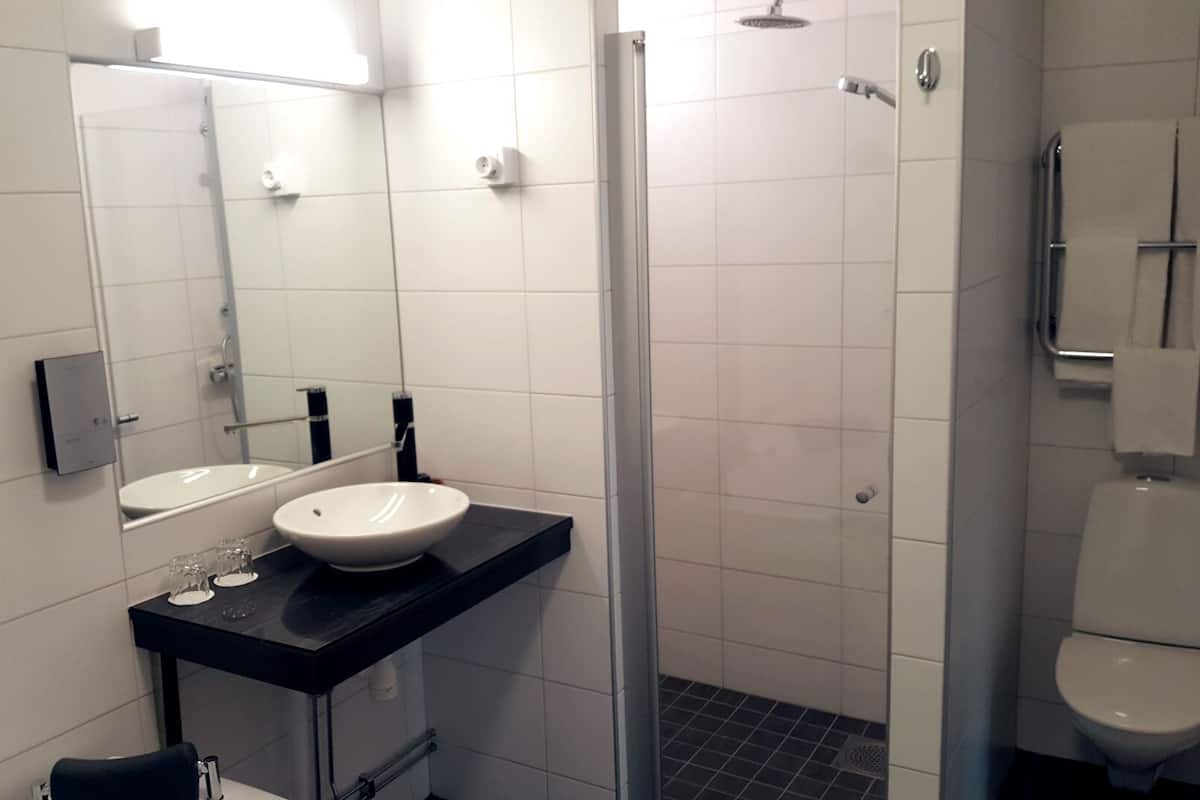 suite | bathroom | hair dryer, towels, soap, toilet paper