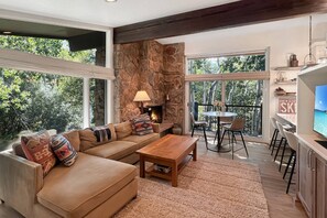 TV, fireplace - Summer in Snowmass! Bright Corner Condo w/ Views, 2 Balconies, Pool/HT, Parking & Trail Access (Snowmass Village)