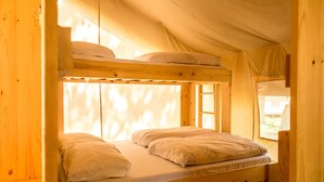 A bunk bed with a window, wooden walls, and a view of the outdoors. - Sunflower Camping Savudrija (Umag)