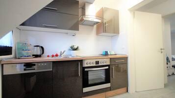 Deluxe Apartment, City View | Private kitchen | Full-size fridge, oven, dishwasher, coffee/tea maker