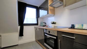 Deluxe Apartment, City View | Private kitchen | Full-size fridge, oven, dishwasher, coffee/tea maker