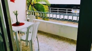 Enjoy a peaceful retreat with a balcony offering a view of the surrounding neighborhood.