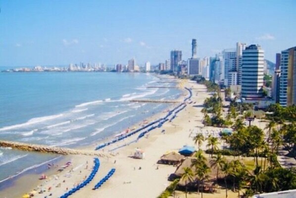 Enjoy the scenic coastal views and relax on the beach with sun loungers and umbrellas.