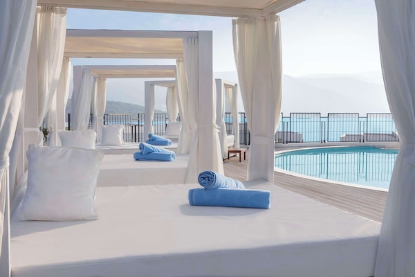 Seasonal outdoor pool, cabanas (surcharge), pool umbrellas