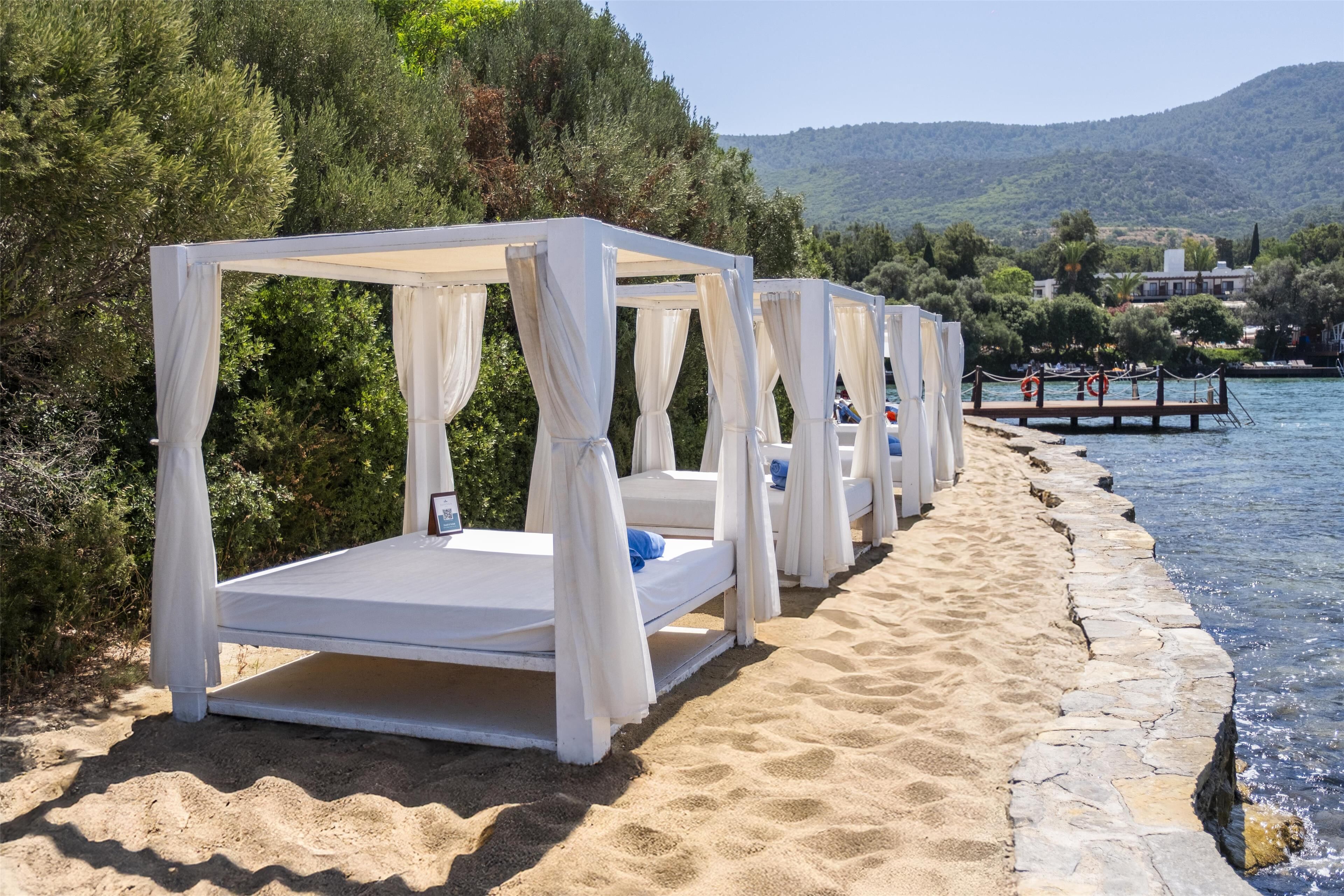 Private beach, beach shuttle, beach cabanas, sun loungers