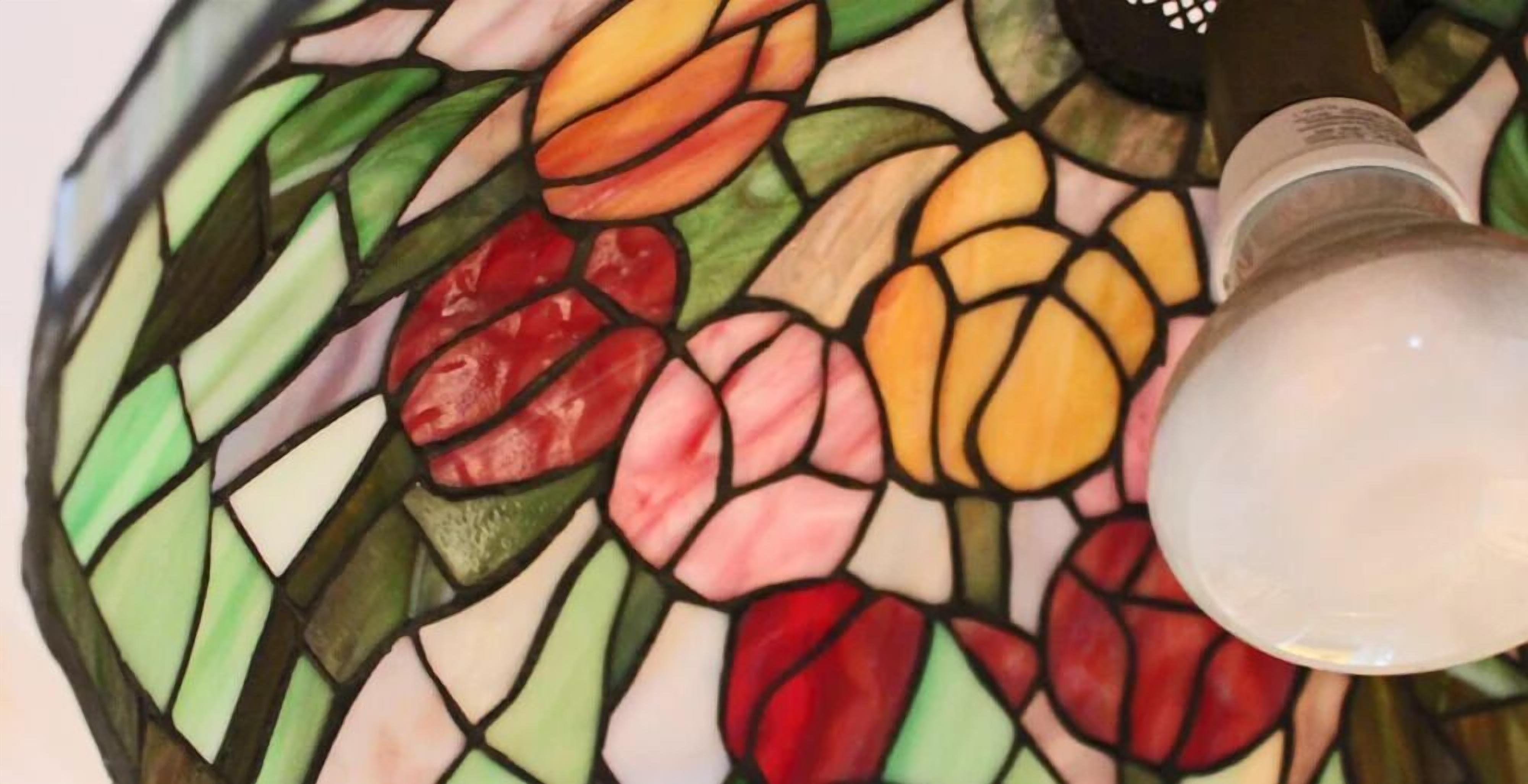 A stained glass window with floral patterns.