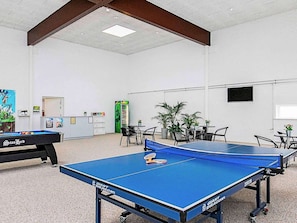 A room with a ping pong table, a pool table, and several chairs. - 6 Person Holiday Home in Brovst (Brovst)