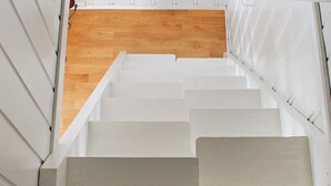 A set of white stairs leading to a wooden floor. - 6 Person Holiday Home in Brevik (Porsgrunn)