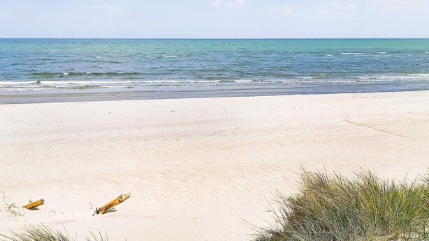 A beach with sand and sparse vegetation. - Holiday Home in LÃ¸kken (Lokken)