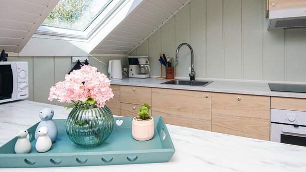 A modern kitchen with a skylight, a sink, and a coffee maker. - 6 Person Holiday Home in Toftlund (Toftlund)