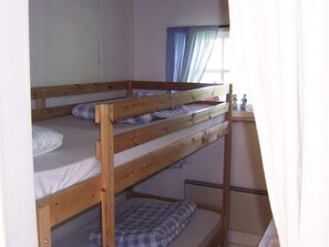 A bunk bed room with a window and curtains. - 4 Person Holiday Home in Lerdala (Lerdala)