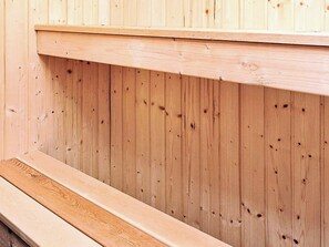A wooden wall with a horizontal beam and a lower ledge.