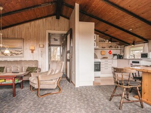 A cozy cabin interior with a living room, dining area, and kitchen. - Superb Holiday Home in Hemmet near Sea (Hemmet)