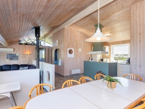 A modern interior with a dining area, kitchen, and living space. - 12 Person Holiday Home in Hjorring (Hjørring)