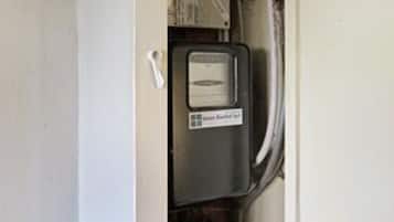 A control panel with a label that reads 'Emergency Stop.'