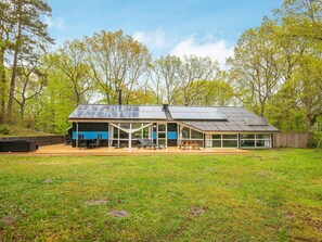 A modern house with a large deck and solar panels. - 5 Star Holiday Home in Glesborg (Glesborg)