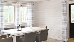 A dining area with a white table, grey chairs, and a lantern. - 27 Person Holiday Home in Dyrdal-by Traum (Gjesdal)
