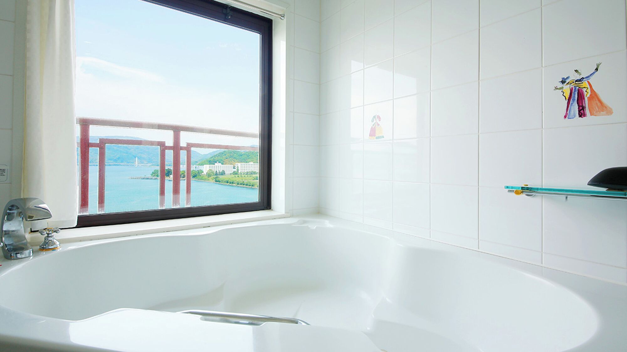 A bathroom with a large bathtub, a window with a view of a bridge and buildings, and a shelf with toiletries.