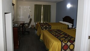 A hotel room with two beds, a desk, and a chair. - Relax Inn (Canton)