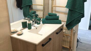 Shower, hair dryer, towels, soap