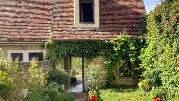 A house with a tiled roof, a small porch, and a garden with a gravel path. - La Dragonne: House with garden, Bellême center, Perche Natural Park value (BELLEME)