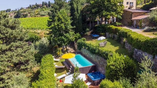 A villa with a swimming pool, outdoor seating, and lush greenery. - Wonderful  villa for 8 people with WIFI, A/C, private pool, TV and patio (Greve In Chianti)