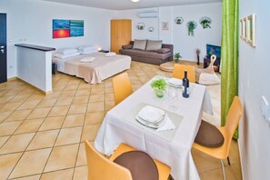 Comfort Apartment, Terrace, Sea View | Living area | 80-cm LED TV with satellite channels, TV - Apartments Nina Hvar town (Hvar)