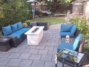 An outdoor patio with a sofa set, a coffee table, and a glass-top table. - SUPERB STUDIO LOCATION, Ballard Locks, Seattle, Wa. (Seattle)