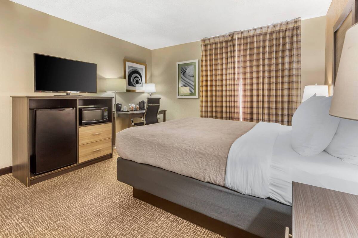 Desk, laptop workspace, blackout curtains, free WiFi