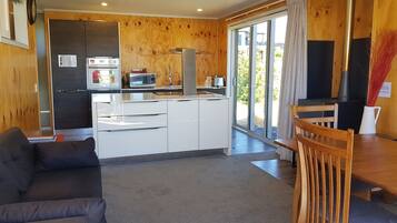 House, 1 Bedroom | Living area | Flat-screen TV