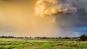 A stormy sky over a rural landscape with fields and a few buildings in the distance. - Cherry Lane Self Catering and BB - Romantic Honeymoon Suite for 2 Bloemfontein (Bloemfontein)