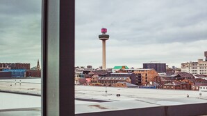 A cityscape with a prominent tower and various buildings. - Kent Street - Apt 15 (Liverpool)
