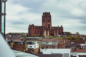 A historic church with a tall tower, surrounded by residential buildings. - Kent Street - Apt 17 (Liverpool)