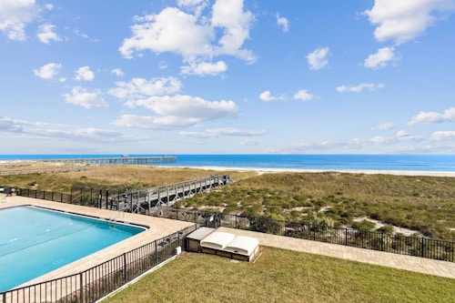 Oceanfront Beach Condo with Private Balcony, Short Walk to Pool and Beach by RedAwning