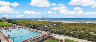 Oceanfront Beach Condo with Private Balcony, Short Walk to Pool and Beach by RedAwning
