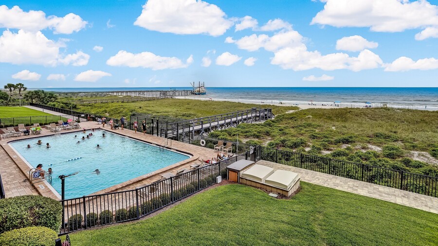 Oceanfront Beach Condo with Private Balcony, Short Walk to Pool and Beach by RedAwning