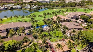 A resort with multiple buildings, a golf course, and a body of water. - Fairway S Waikoloa J21 2 Bedroom Villa by RedAwning (Waikoloa)