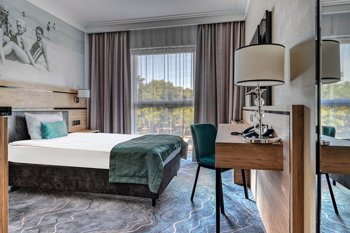 Habitación individual clásica | 1 dormitorio, tabla de planchar con plancha, wifi gratis y ropa de cama