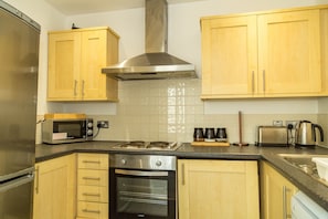 Apartment | Private kitchen | Full-size fridge, microwave, oven, stovetop