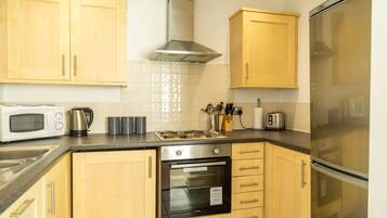 Apartment, 2 Bedrooms | Private kitchen | Full-sized fridge, microwave, oven, stovetop