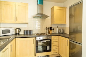 Apartment, 2 Bedrooms | Private kitchen | Full-size fridge, microwave, oven, stovetop