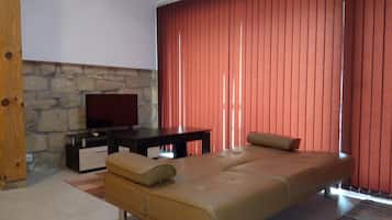 Room, 1 Bedroom, Smoking, Patio | Living area | TV