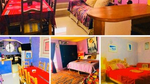 A multi-room hotel with a dining area, a bedroom with a bed and a nightstand, a bathroom with a sink and mirror, and a living area with a sofa and a table. - Amazing House of View (San Cristóbal de las Casas)