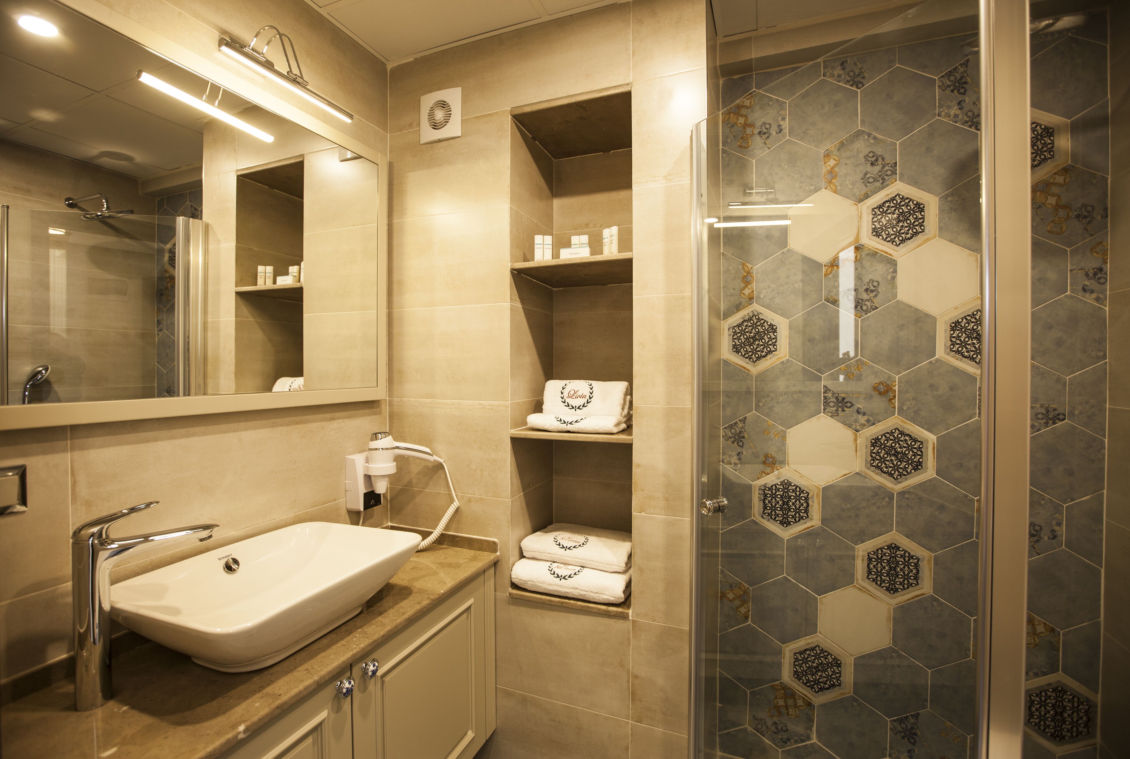 deluxe double or twin room | bathroom | shower, hydromassage showerhead, free toiletries, hair dryer