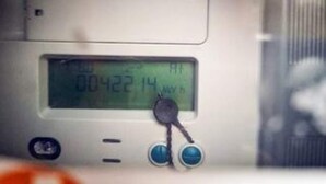A digital display with numbers and a control knob.