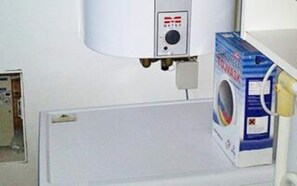A room with a washing machine, a control panel, and a door. - 6 Person Holiday Home in Albaek (Jerup)
