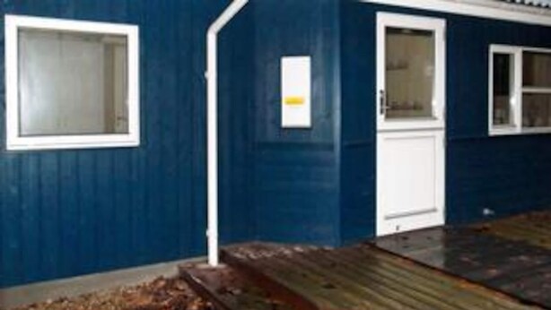 A building with a blue exterior, white doors, and windows. - 5 Star Holiday Home in Oksbol (Oksbol)