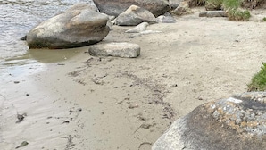 A natural landscape with a river, large rocks, and grassy areas. - Holiday Home in SÃ¶lvesborg (Sölvesborg)